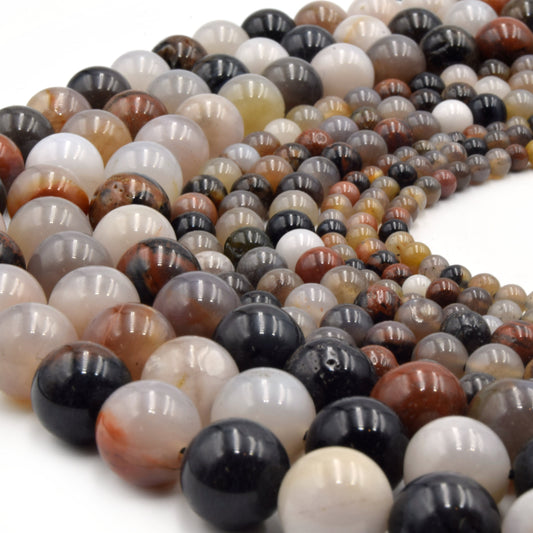 Close-up of multicolored agate beads on a white background