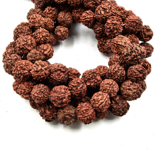 Close-up of a bracelet made from brown knotted beads on a white background