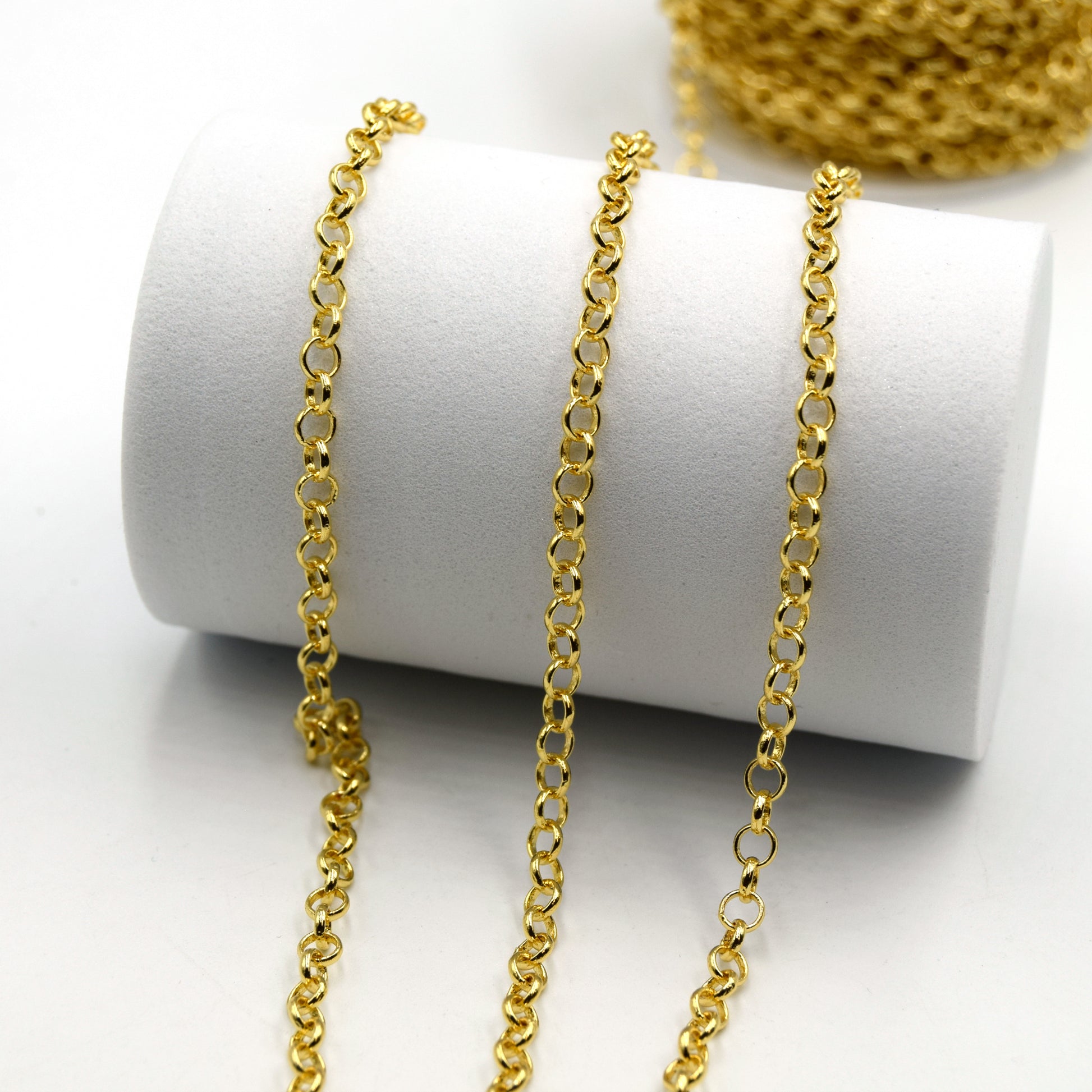 This is a photograph of 4mm Rollo Link Chain that is used in jewelry making and is sold by the foot.