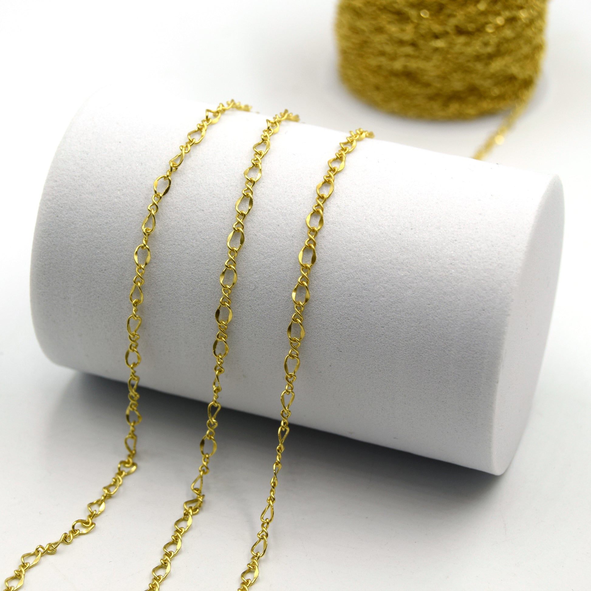This a photo of a style of gold plated link chain that is available for purchase by the foot.
