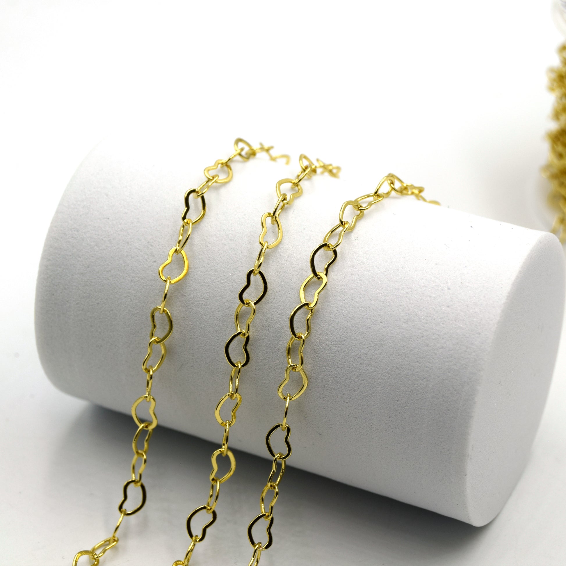 This is a gold plated heart link chain that is used in jewelry making. It is dainty and perfect for necklaces, bracelets, anklets, and chokers.