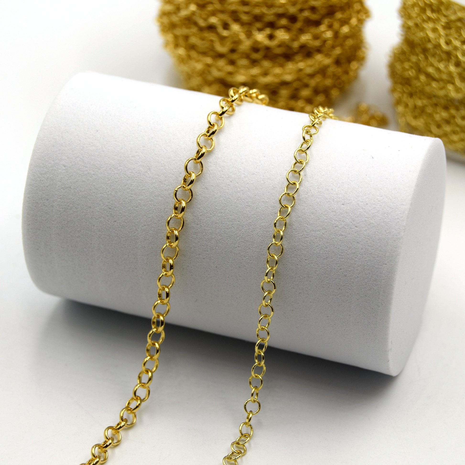 This is a photograph of two styles of rollo link chain that is used in jewelry making. This picture features 3mm and 4mm link chain that is sold by the foot.