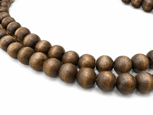 A close-up of dark brown wooden beads with a natural wood grain texture, arranged in a curved line on a white background.