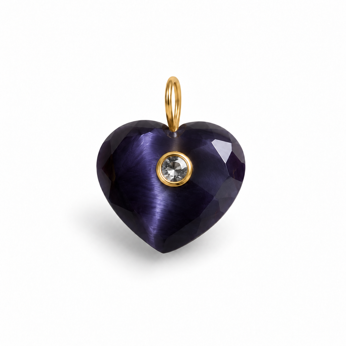 A heart-shaped pendant charm made of faceted dark purple glass with a small gold bail at the top and a gold bezel holding a clear round crystal, shown on a white background.