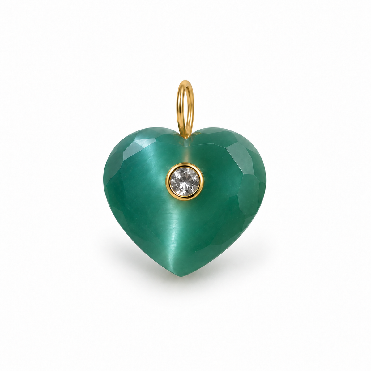 A heart-shaped pendant made of faceted green cat's eye stone with a small round clear gemstone in a gold bezel setting, suspended from a gold loop, on a white background.