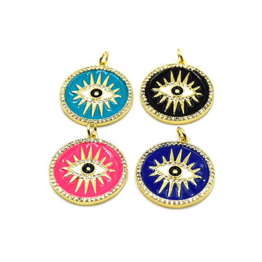 This photo features four intricately designed evil eye charms that make up a unique piece of jewelry.