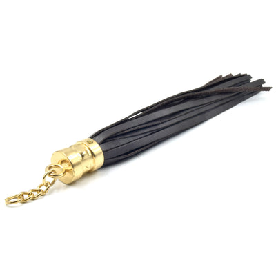 gold studded cap brown leather tassel