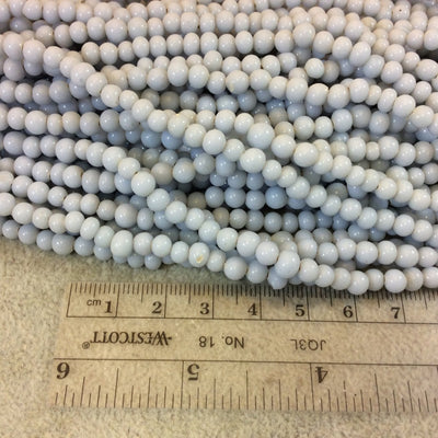 4mm Glossy Pale Light Blue Quality Irregular Rondelle Shape Indian Ceramic Beads - Sold by 16.25" Strand - Approximately 98 Beads