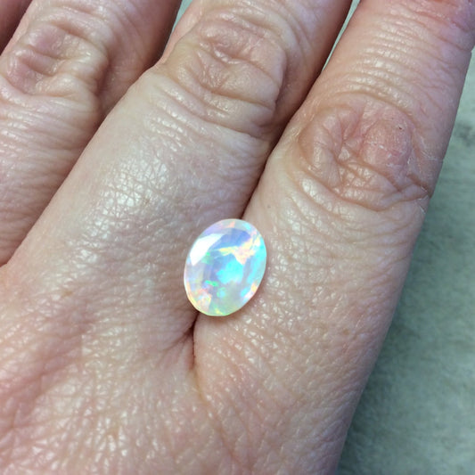 2.215 Carat Faceted Genuine Ethiopian Opal Oval Cut Stone "F-B" - Measuring 8.5mm x 11mm with 6.5mm Pavillion (Base) and 0.5mm Crown (Top)