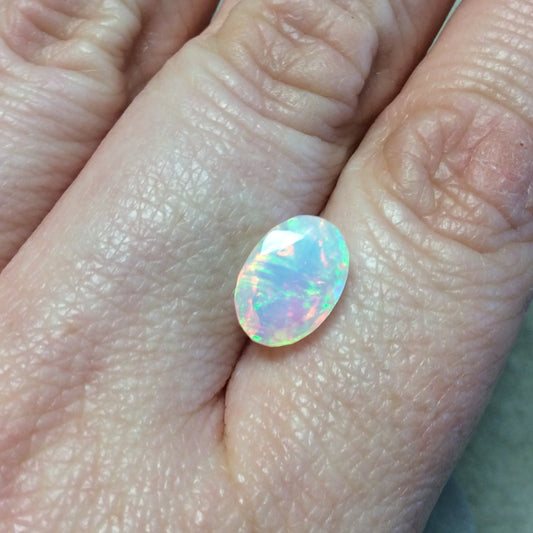 2.465 Carat Faceted Genuine Ethiopian Opal Oval Cut Stone "F-M" - Measuring 8.5mm x 12mm with 6mm Pavillion (Base) and 1mm Crown (Top)