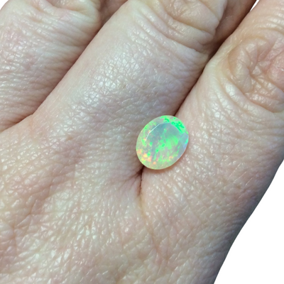 1.385 Carat Faceted Genuine Ethiopian Opal Oval Cut Stone "F-S" - Measuring 8mm x 10mm with 4.5mm Pavillion (Base) and 1mm Crown (Top)