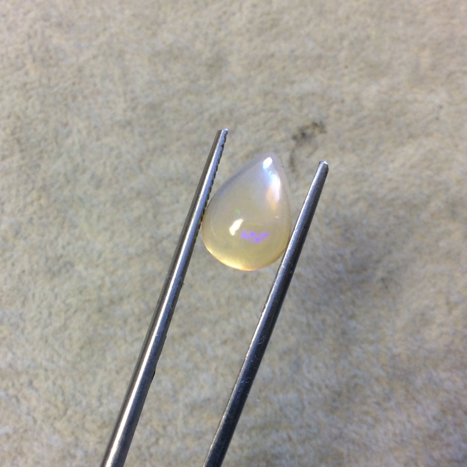 Natural Ethiopian Opal Smooth Teardrop Shaped Flat Back Cabochon 'ZZ' - Measuring 9.5mm x 13mm, 4.5mm Dome Height - High Quality Gemstone