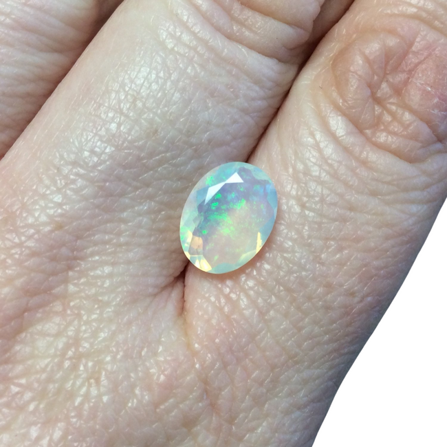 1.93 Carat Faceted Genuine Ethiopian Opal Oval Cut Stone "F-F" - Measuring 9mm x 11.5mm with 4mm Pavillion (Base) and 1mm Crown (Top)