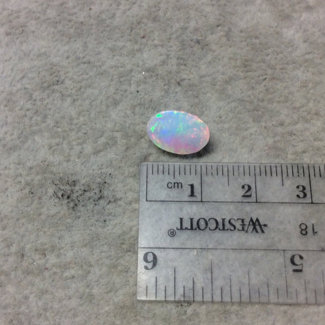 2.465 Carat Faceted Genuine Ethiopian Opal Oval Cut Stone "F-M" - Measuring 8.5mm x 12mm with 6mm Pavillion (Base) and 1mm Crown (Top)