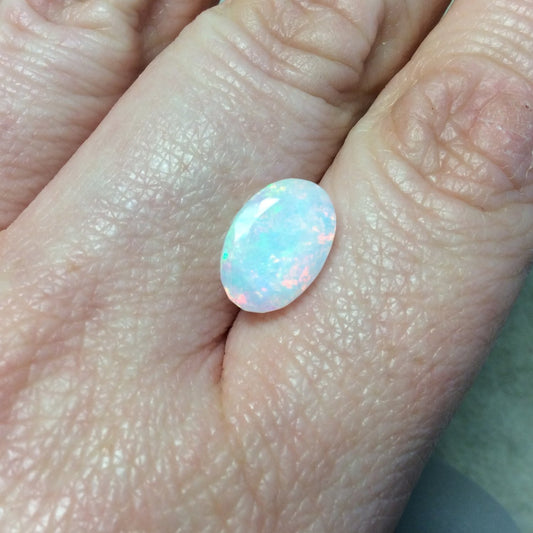 2.555 Carat Faceted Genuine Ethiopian Opal Oval Cut Stone "F-N" - Measuring 9mm x 12.5mm with 5.5mm Pavillion (Base) and 0.5mm Crown (Top)