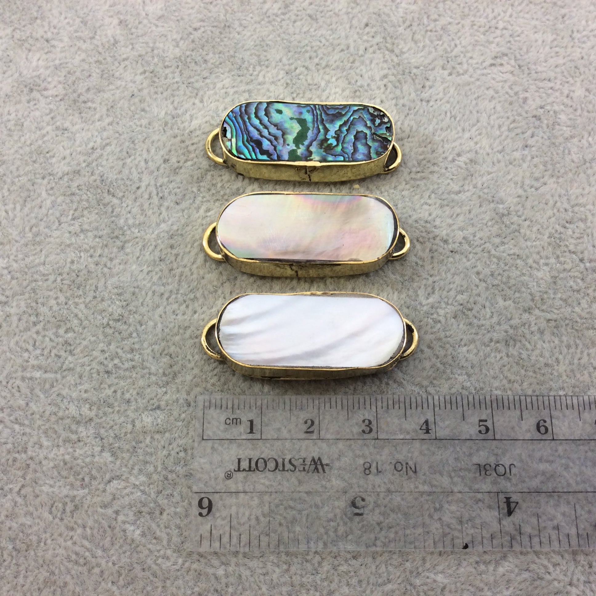 1.25" Iridescent Gray Natural Abalone Shell Skinny Oval Shaped Gold Plated Bezel Connector - Measuring 14mm x 33mm.