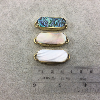 1.25" Iridescent white Natural Abalone Shell Skinny Oval Shaped Gold Plated Bezel Connector - Measuring 14mm x 33mm.
