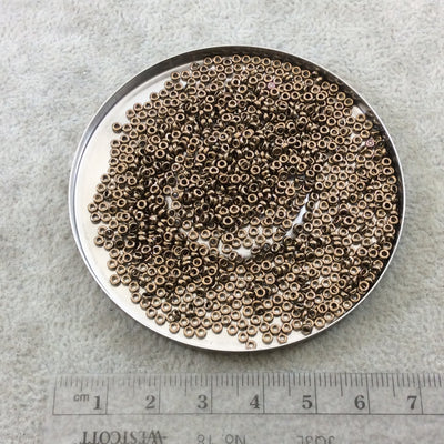 1mm x 2mm Glossy Metallic Bronze Genuine Miyuki Glass Seed Spacer Beads - Sold by 7 Gram Tubes (Approx 770 Beads per Tube) - (SPR2-457)