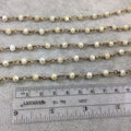 Brass Plated Copper Wrapped Rosary Chain with 6mm Faceted Opaque Ivory White Glass Crystal Rondelle Beads - Sold by the Foot (RC46-072-BR)