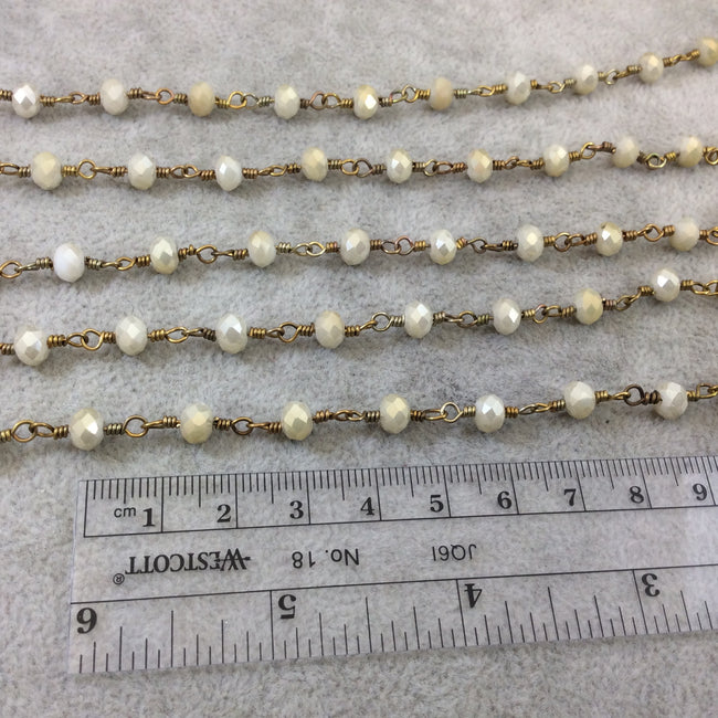 Brass Plated Copper Wrapped Rosary Chain with 6mm Faceted Opaque Ivory White Glass Crystal Rondelle Beads - Sold by the Foot (RC46-072-BR)