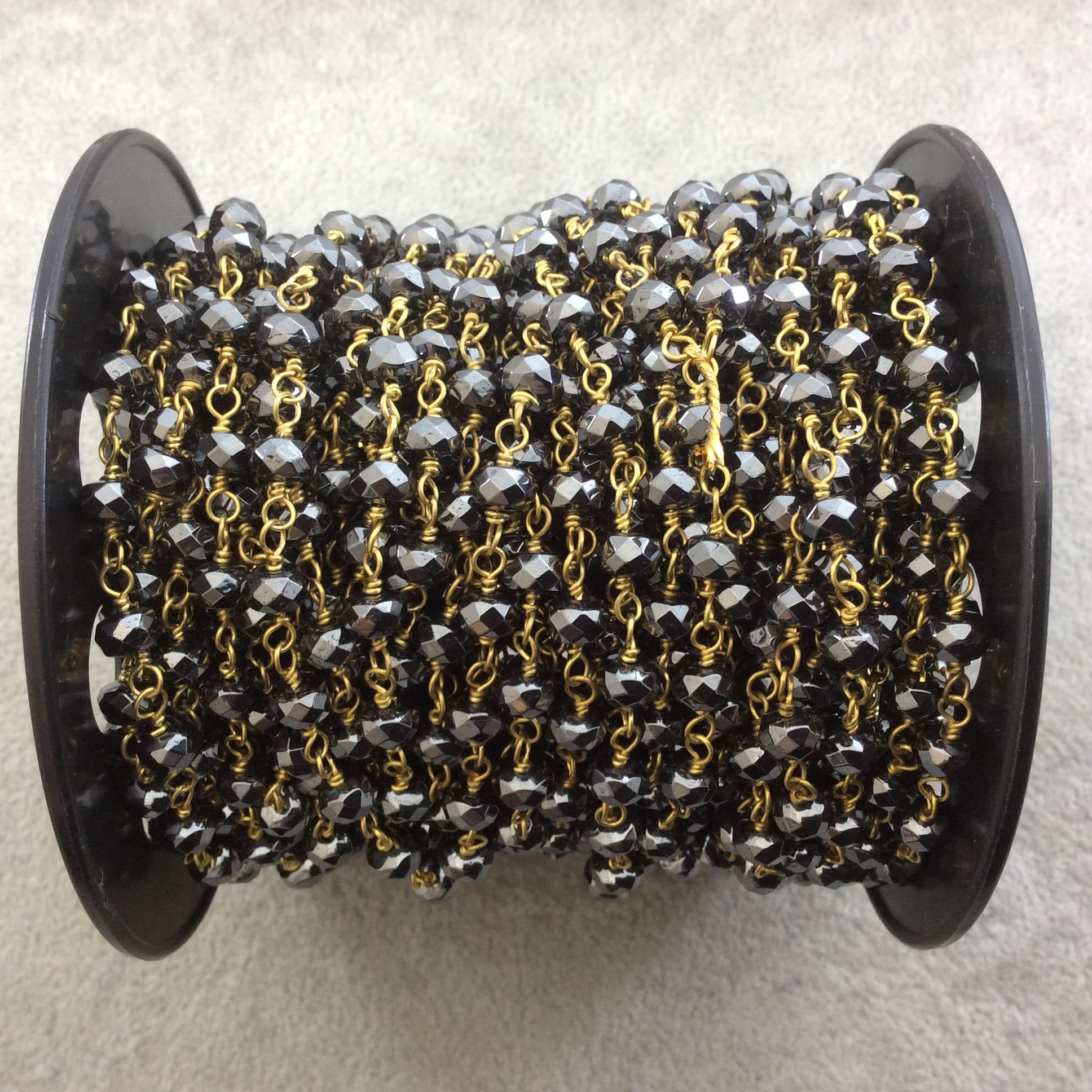 Gold Plated Copper Wrapped Rosary Chain with 4mm x 6mm Faceted Natural Hematite Rondelle Shaped Beads - Sold by the Foot!