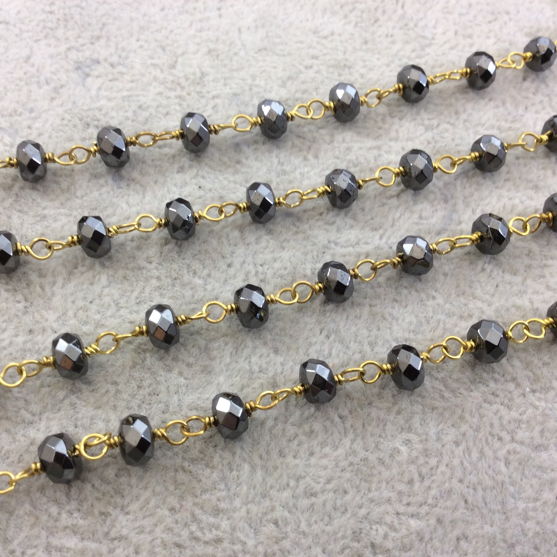 Gold Plated Copper Wrapped Rosary Chain with 4mm x 6mm Faceted Natural Hematite Rondelle Shaped Beads - Sold by the Foot!