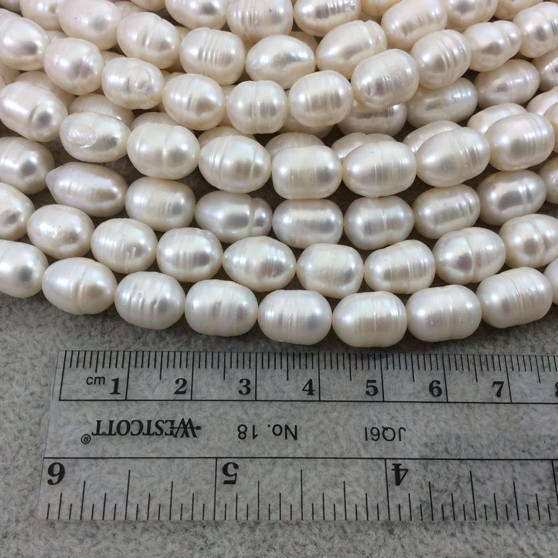 10mm-12mm AB Quality Natural Freshwater White Rice/Oval Shaped Beads - 14.25" Strand (Approx. 33 Beads) - Sold by the Strand