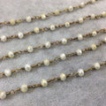 Brass Plated Copper Wrapped Rosary Chain with 6mm Faceted Opaque Ivory White Glass Crystal Rondelle Beads - Sold by the Foot (RC46-072-BR)
