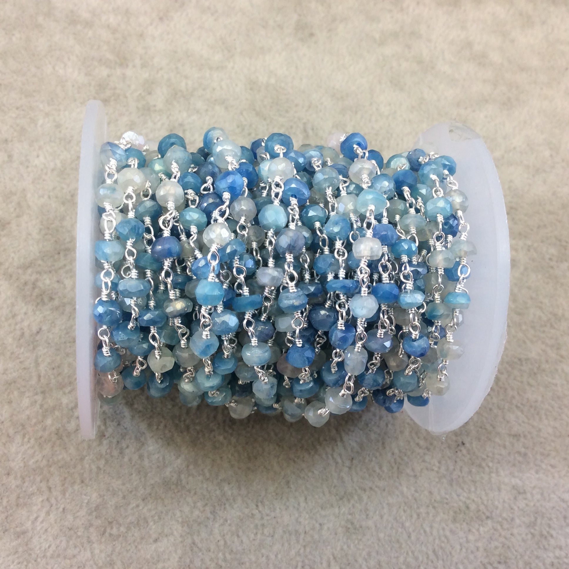 Silver Plated Copper Rosary Chain with Faceted 3-4mm Rondelle Shaped Mystic Coated Mixed Blue/White Moonstone Beads - Sold Per Ft - CH142-SV