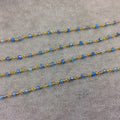 Gold Plated Copper Rosary Chain with Faceted 3-4mm Rondelle Shaped Mystic Coated Medium Blue Moonstone Beads - Sold Per Ft - CH143-GD