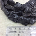 18mm x 26mm Waxed/Coated Black Colored Volcanic Lava Rock Wavy Rectangle Shape Beads W 1mm Holes - Sold by 15.25" Strands (Approx. 16 Beads)
