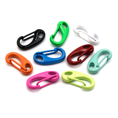 A collection of colorful neon enamel clasps for jewelry making in various colors.