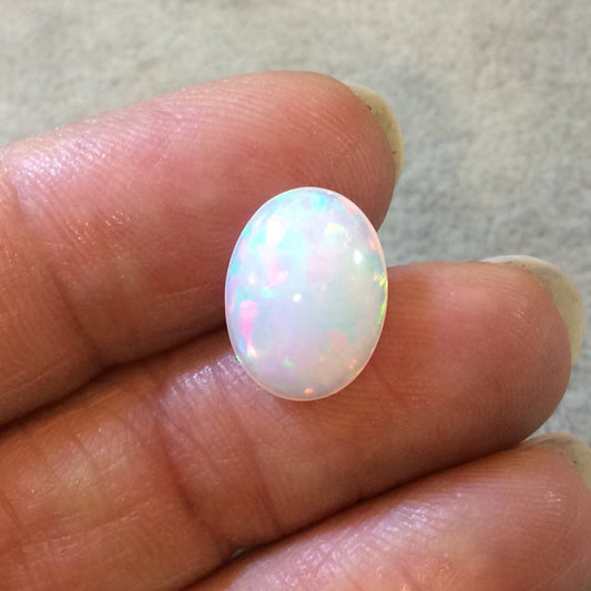 High Quality Smooth Oval Rainbow Pinfire Ethiopian Opal Semi-Precious Gemstone Cabochon "1014OB"- Measuring 10.5mm x 13.9mm x 5.3mm