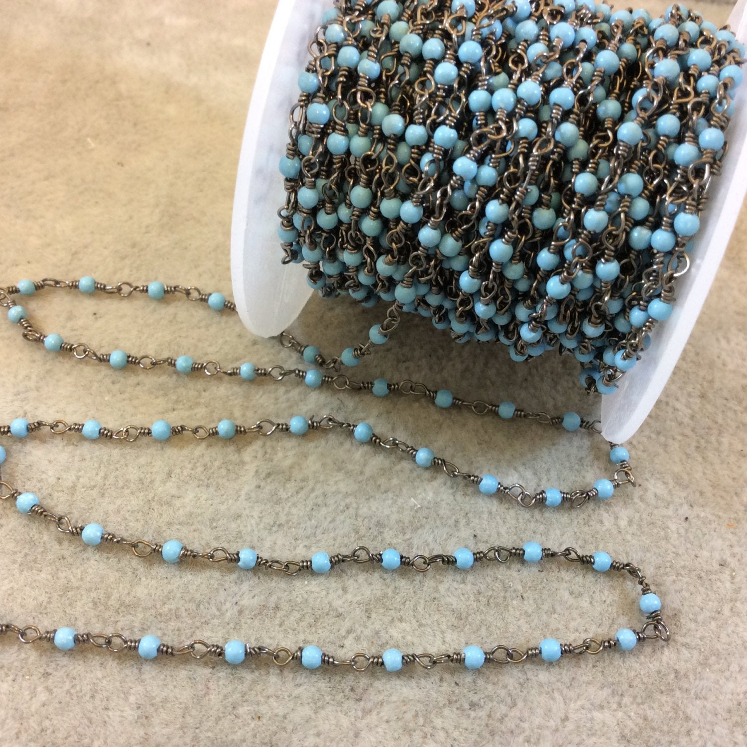 Gunmetal Plated Wrapped Copper Rosary Chain with Smooth 2mm Round Shaped Dyed Light Blue Howlite Beads - Sold in 1' Increments - (CH009-GM)