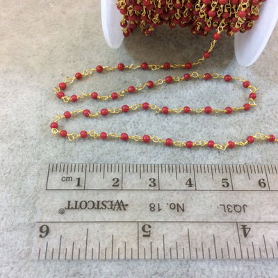 Gold Plated Wrapped Copper Rosary Chain with Smooth 2mm Round Shaped Dyed Bright Red Howlite Beads - Sold in 1' Increments - (CH005-GD)