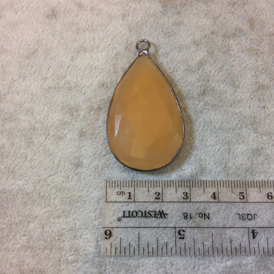 Gunmetal Finish Faceted Light Orange Chalcedony Teardrop Shaped Bezel Pendant - Measuring 28mm x 47mm - Natural Semi-precious Gemstone