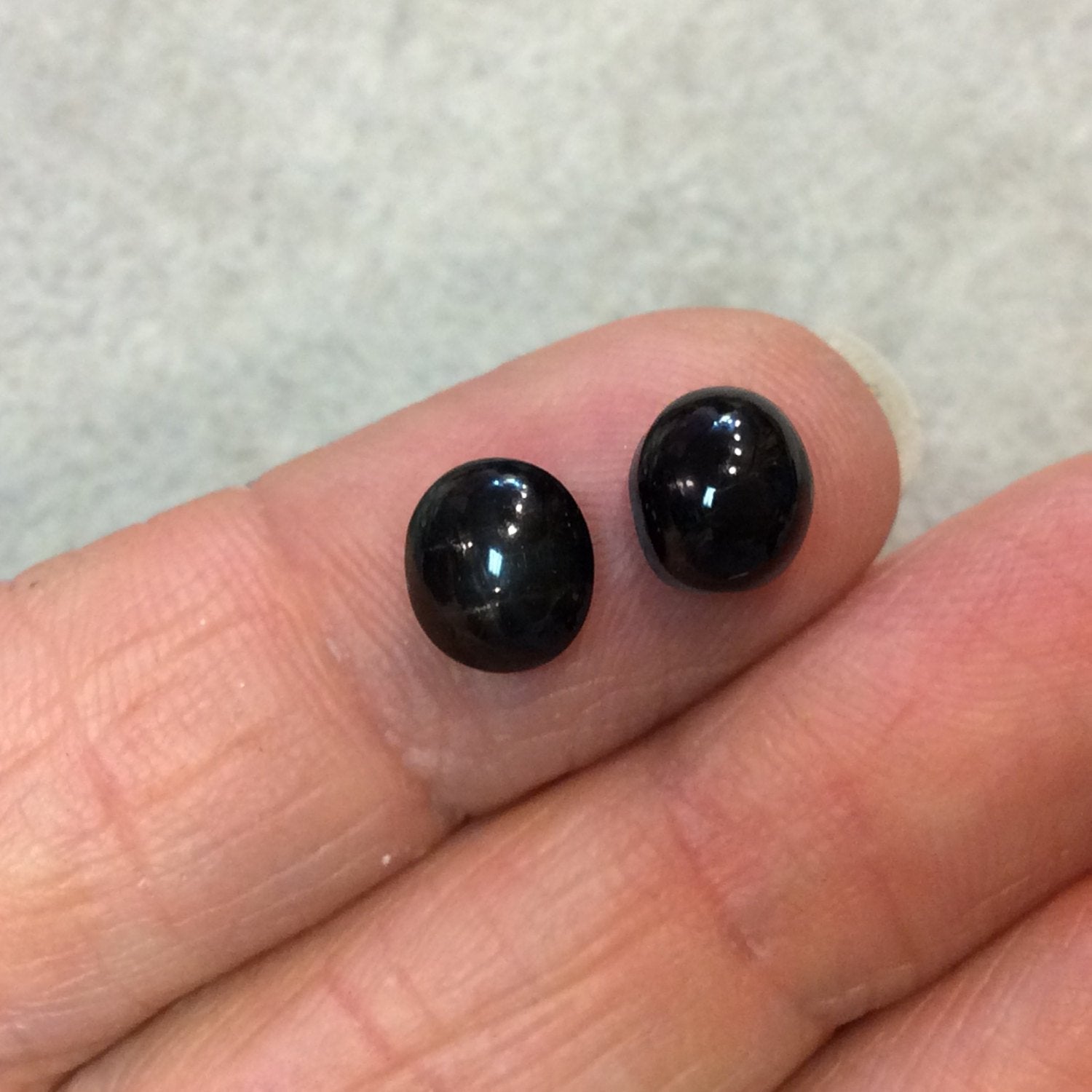 Matching Pair "G" of AAA Oval Shaped Black Star Sapphire Flat Back Cabochons - Measuring 7mm x 8mm, 5mm Dome Height - Natural Gemstone Cabs