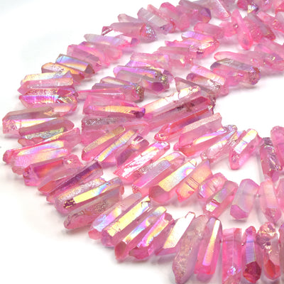 A set of pink aura quartz stick beads, perfect for jewelry making or crafting projects.