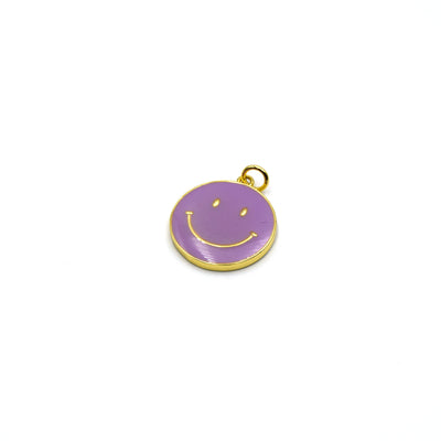 This gold plated purple enamel charm is shaped like a smiley face and is perfect for making jewelry.