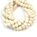 white bone beads bullseye carving