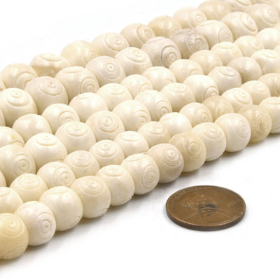 white bullseye carved bone beads