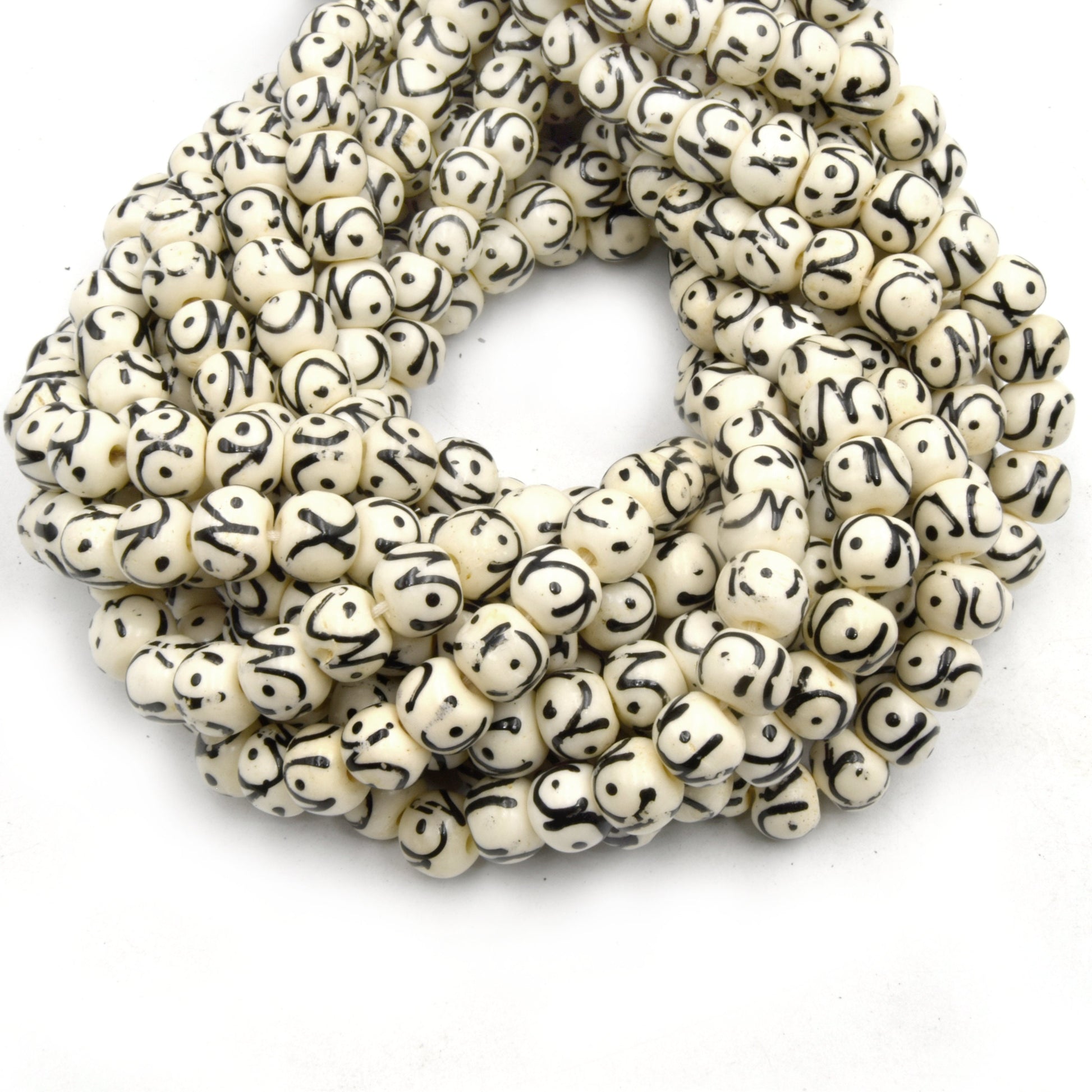 white painted bone bead