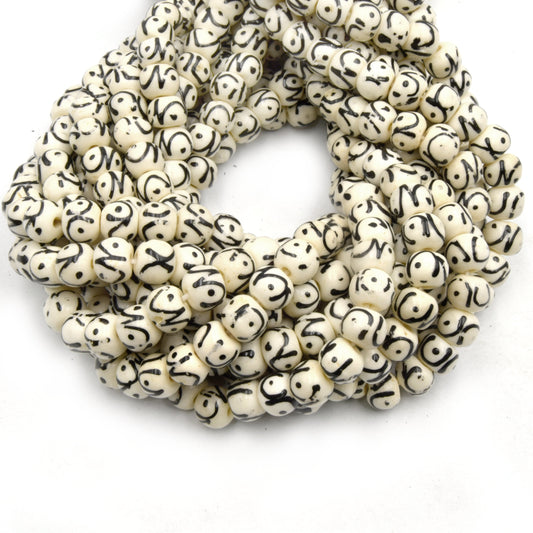 white painted bone bead