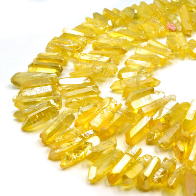 A set of yellow aura quartz stick beads, perfect for jewelry making or crafting projects.